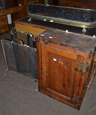 Lot 558 - An oak wall cupboard, a Victorian brass fender, another, a spark guard and a four panel fire screen