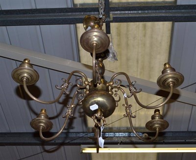 Lot 583 - A brass chandelier, decorated with a double-headed eagle