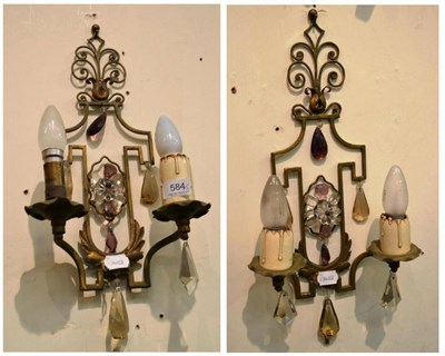 Lot 584 - A pair of jewelled and cold painted wall lights