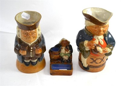 Lot 22 - Two Royal Doulton Toby jugs and a match striker