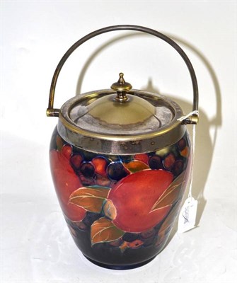 Lot 24 - A William Moorcroft pomegranate pattern biscuit barrel, circa 1920's, impressed factory marks...