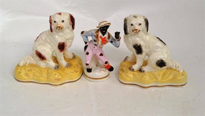 Lot 46 - Pair of 19th century porcelain Staffordshire dogs and Staffordshire figure of Jim Crow