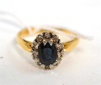 Lot 77 - Sapphire and diamond cluster ring stamped '18ct'