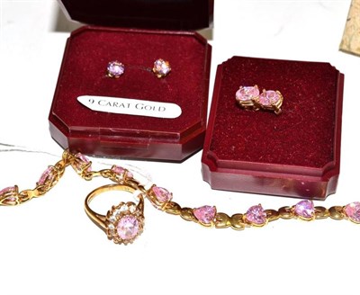 Lot 98 - A 9ct gold pink cubic zirconia bracelet and a 9ct gold cluster ring and two pairs of earrings