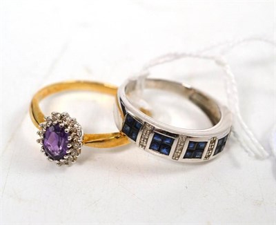 Lot 105 - An amethyst and diamond cluster ring and a sapphire half eternity ring