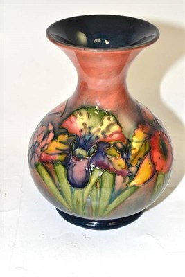 Lot 144 - A Walter Moorcroft flambé orchid and spring flowers pattern vase, impressed factory marks...