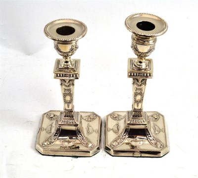 Lot 148 - A pair of silver candlesticks