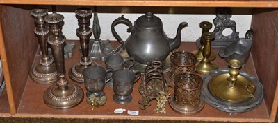 Lot 199 - Shelf of metal ware, including pewter plates, brass and plated candlesticks, a print of yacht...