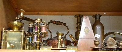 Lot 204 - A shelf of brass and copper including; kettles, candlesticks, coffee grinder, pestle and mortar etc