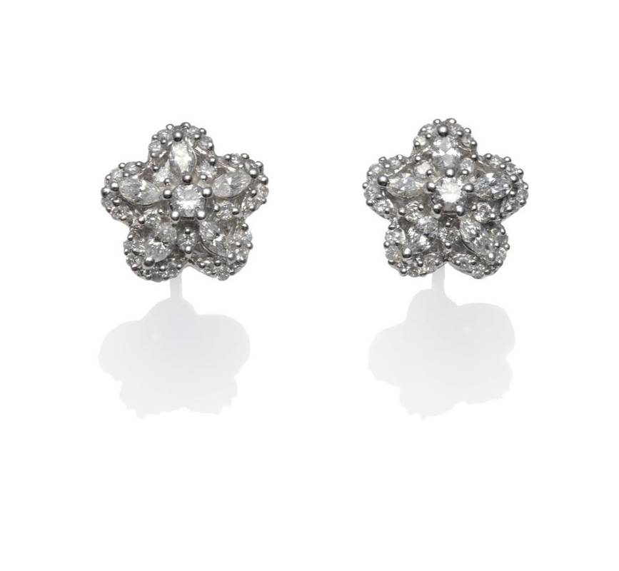 Lot 365 - A Pair of Diamond Cluster Stud Earrings, round brilliant cut and marquise cut diamonds arranged...