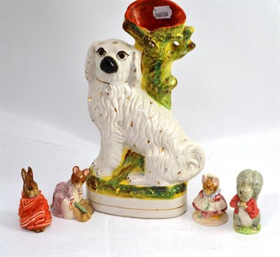 Lot 262 - Staffordshire spaniel spill vase and four Peter Rabbit figures - Poorly Peter Rabbit, Timmy...