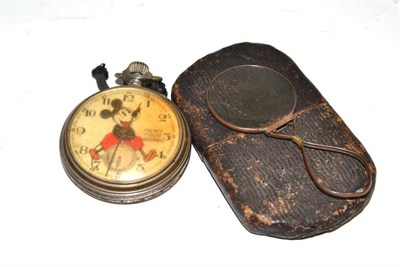 Lot 286 - A chromium plated Mickey Mouse Ingersoll pocket watch and a 19th century magnifier in card case