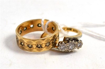 Lot 290 - A diamond three stone ring stamped '18CT' and 'PLAT', circa 1930; and a 9ct gold full eternity ring