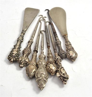 Lot 315 - Six button hooks and two shoe horns with silver handles