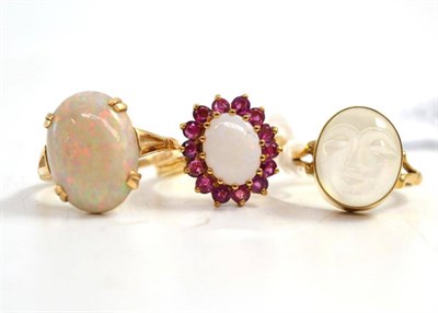 Lot 322 - A 9ct gold moonstone signet ring, a 9ct gold opal and ruby cluster ring and a opal ring