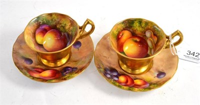 Lot 342 - A pair of Royal Worcester fruit painted cabinet cups and saucers, painted by Price & Townsend