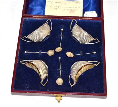 Lot 344 - A cased set of four silver salts with spoons in fitted case