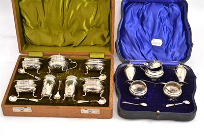 Lot 354 - Two cased silver condiment sets