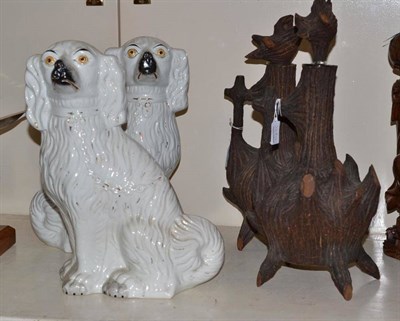 Lot 368 - A pair of large Staffordshire spaniels; a pair of ";Black Forest"; type decanters and stoppers