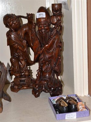 Lot 369 - Pair of Chinese root wood figures, a pair miniature shoes and four German pin dolls