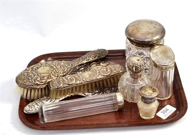 Lot 394 - Five silver topped jars, a hand mirror and two brushes