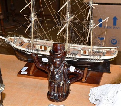 Lot 399 - A wooden galleon and a Toby jug