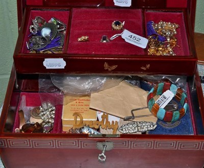 Lot 452 - A jewellery box containing dress rings, silver brooches, paste jewellery, coral etc