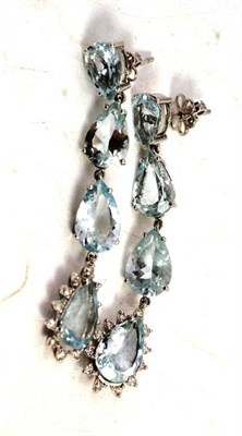 Lot 479 - A pair of aquamarine and diamond drop earrings, the four pear cut aquamarines chain linked to...