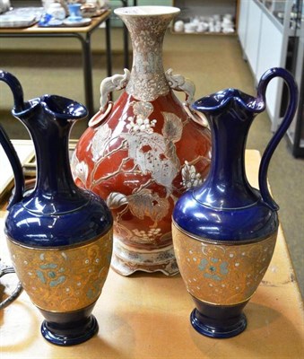 Lot 487 - A Japanese twin handle Satsuma vase and a pair of Royal Doulton stoneware vases