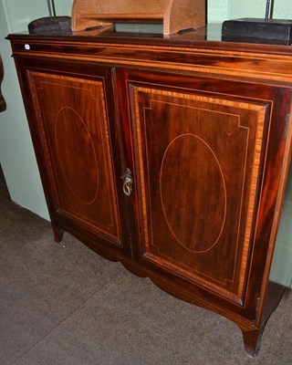 Lot 559 - A 19th century cross banded mahogany two door cupboard