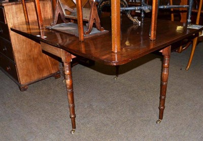 Lot 580 - A 19th century mahogany drop-leaf table