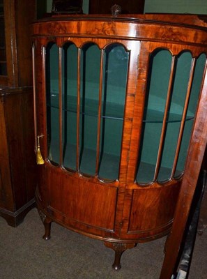 Lot 588 - A 1920/30's walnut bow fronted china cabinet