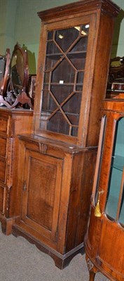 Lot 589 - A 19th century oak glazed bookcase on covered base