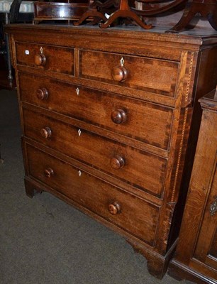 Lot 591 - A 19th century cross banded oak chest of drawers