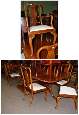 Lot 593 - Walnut pedestal table and a set of eight walnut chairs (6+2)