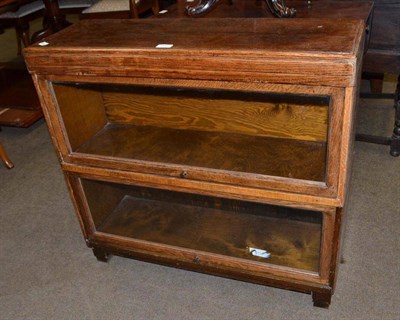 Lot 604 - Globe Wernicke two sectional oak glazed bookcase