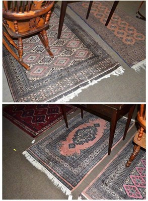 Lot 615 - A red ground rug and four others