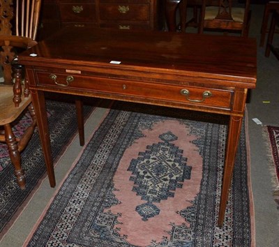 Lot 620 - A 19th century mahogany fold-over tea table