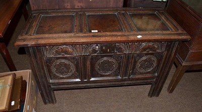 Lot 625 - An 18th century carved oak coffer