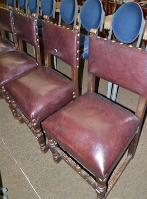 Lot 648 - Set of four oak and leather upholstered chairs