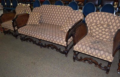 Lot 650 - A 1920's oak framed single cane three-piece bergere suite