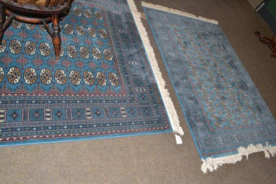 Lot 661 - Two Hali blue ground rugs