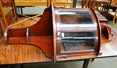 Lot 668 - An Edwardian mahogany glazed corner cupboard