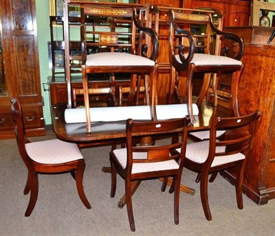 Lot 678 - Mahogany pedestal table and eight brass inlaid mahogany dining chairs