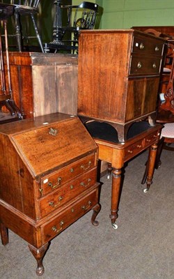 Lot 685 - An oak bureau of small proportions, a 19th century oak two drawer writing table and a Georgian...