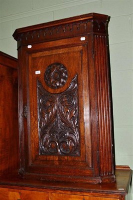 Lot 690 - 19th century carved oak hanging corner cupboard