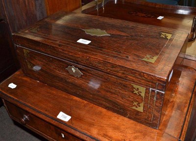 Lot 705 - A rosewood travelling writing desk with brass inlay and handles