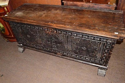 Lot 708 - An 18th century carved oak coffer