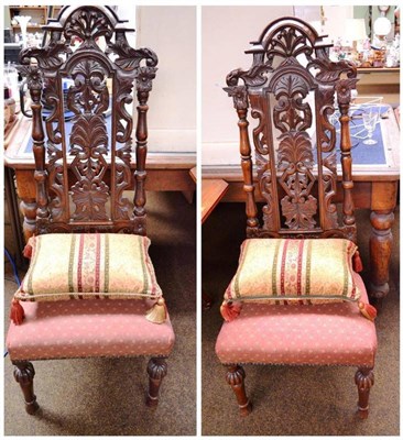 Lot 717 - A pair of Victorian carved oak side chairs