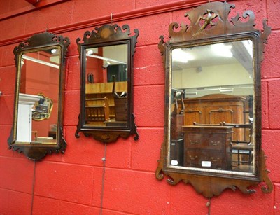 Lot 785 - Three mahogany fret cut mirrors